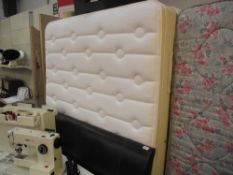 A 4'6" mattress with base and headboard