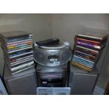 A Sharp music system, Phillips cd player and quantity of CD's.