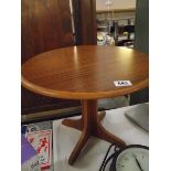 A vintage teak effect side/coffee table
