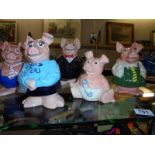 A set of 5 Nat West Wade pigs, money boxes, Dad is a/f and baby is missing his stopper