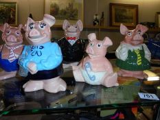 A set of 5 Nat West Wade pigs, money boxes, Dad is a/f and baby is missing his stopper