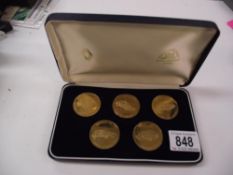 A cased vintage Renault launch date 1986 medallion set