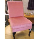 A pink draylon bedroom chair on Queen Anne legs