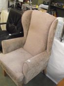 A brown draylon wing arm chair