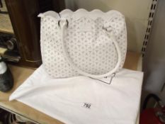 A new with tags Lulu Guinness white perforated leather scalloped small Wanda bag with storage bag