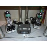 A digital clock radio and set of BT phones