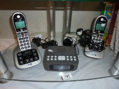 A digital clock radio and set of BT phones