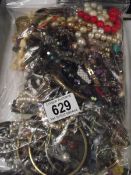 A bag of mixed costume jewellery