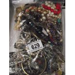 A bag of mixed costume jewellery