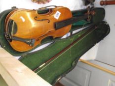 A cased violin and bow
