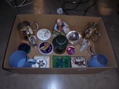 A box of miscellaneous items including tankards, paperweights etc.