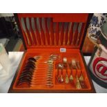 A vintage 42 piece gold plated cutlery set, made in Sheffield