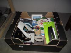 A box containing office type items and crossword and puzzle books ec