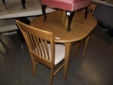 A small extending oval dining table for 2 (includes 2 chairs)