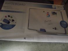 A boxed United office white board, complete with magnets and pen