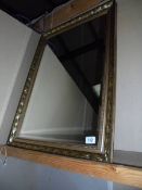 A qilt framed, bevel edge mirror. 61cm x 87cm.