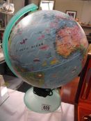 An illuminated world globe, in working order