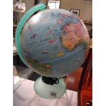 An illuminated world globe, in working order