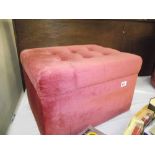 A pink draylon bedroom storage box/stool