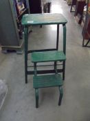 A vintage industrial folding stool/steps