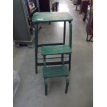 A vintage industrial folding stool/steps