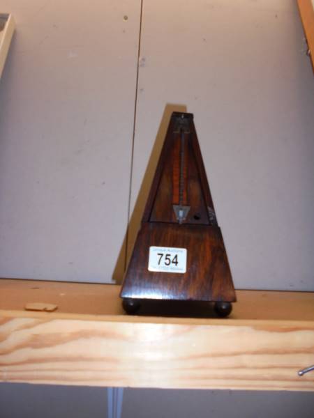 A metronome. (Missing cover)