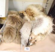 A fox fur stole and 1 other