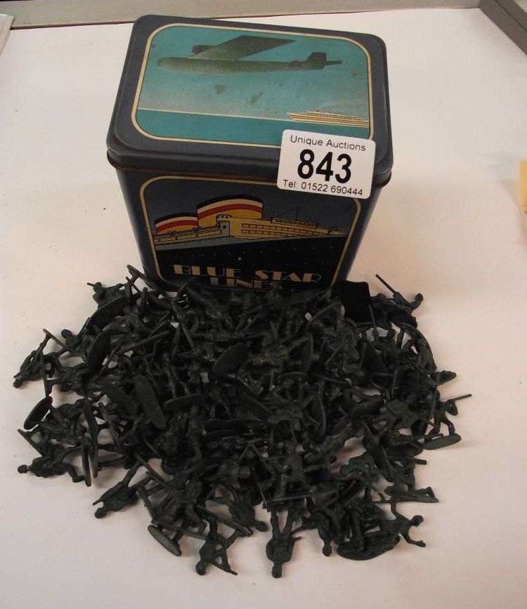 A blue star lines vintage tin containing plastic soldiers