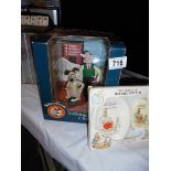 A boxed Wallace and Gromit, talking alarm clock and boxed Beatrix Potter soap and dish.