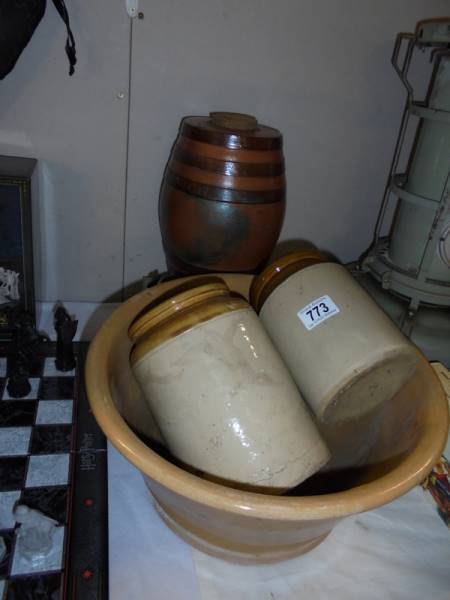 A stoneware Scotch barrel with brass tap and stoneware mixing bowl and 2 storage jars.