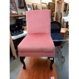 A pink Draylon bedroom chair on Queen Anne legs