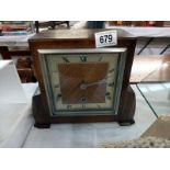 AN oak mantle clock.