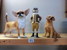 2 dog figures and a meerkat