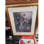 A gilt framed print of people on horses in the dark