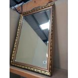 A gilt framed, bevel edge mirror. 61cm x 87cm.