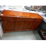 A sideboard with flame mahogany veneered finish, 4 doors, 3 drawers