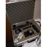 A canon A1 1984 Olympic games 35mm camera with lenses and accessories in hard case. (chip in