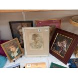 A selection of picture frames various sizes containing portraits