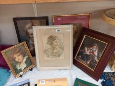 A selection of picture frames various sizes containing portraits