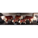 A collection of Coopercraft bull, cow and calf figures