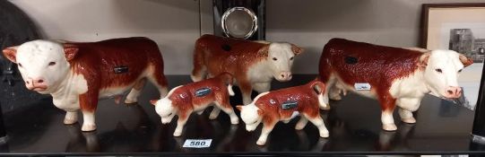 A collection of Coopercraft bull, cow and calf figures