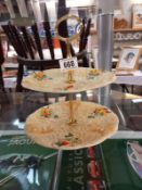A Clarice Cliff Celtic harvest 2 tier cake stand. Crazing with staining under the glaze.
