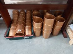 A good quantity of gold coloured pottery pot plants