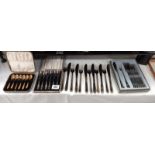 A boxed set of fish knife and forks by Guy Degrenne, boxed cake forks, boxed spoons and a loose