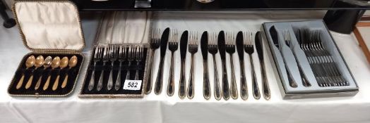 A boxed set of fish knife and forks by Guy Degrenne, boxed cake forks, boxed spoons and a loose