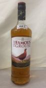 A large bottle of Famous Grouse Scotch Whisky (Donated by a Kind Lady)