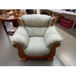 A teak framed leather armchair