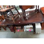 An Ercol style dark oak refrectory dining table