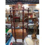 A Victorian inlaid mahogany what not shelf unit