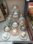 A good assortment of decorative cups and saucers, coffee cans and saucers including Aynsley, Shelley